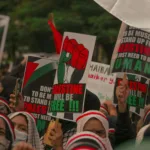 protesters holding posters during their rally
