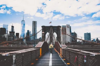 man walking on bridge