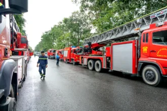 fire trucks parked on the street in city