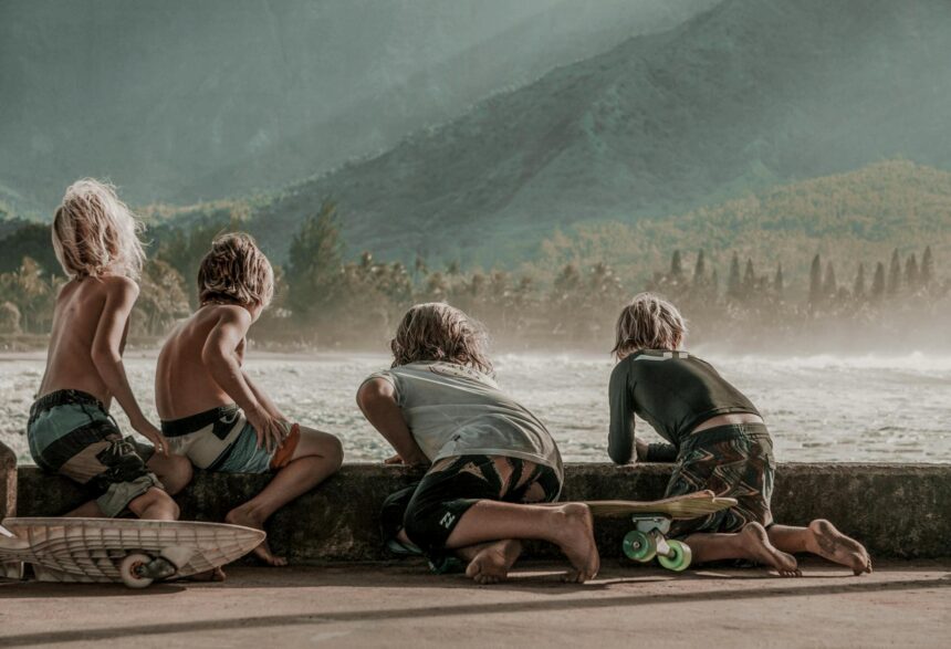 four children looking at sea