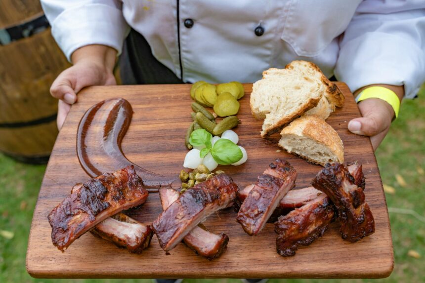 photo of grilled meat on wooden chopping board