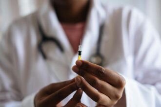 person holding injection