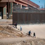 family crossing a border