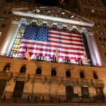 american flag illuminated on building
