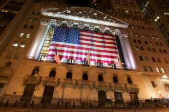 american flag illuminated on building