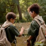 two boys looking a map