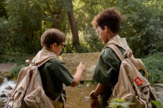 two boys looking a map