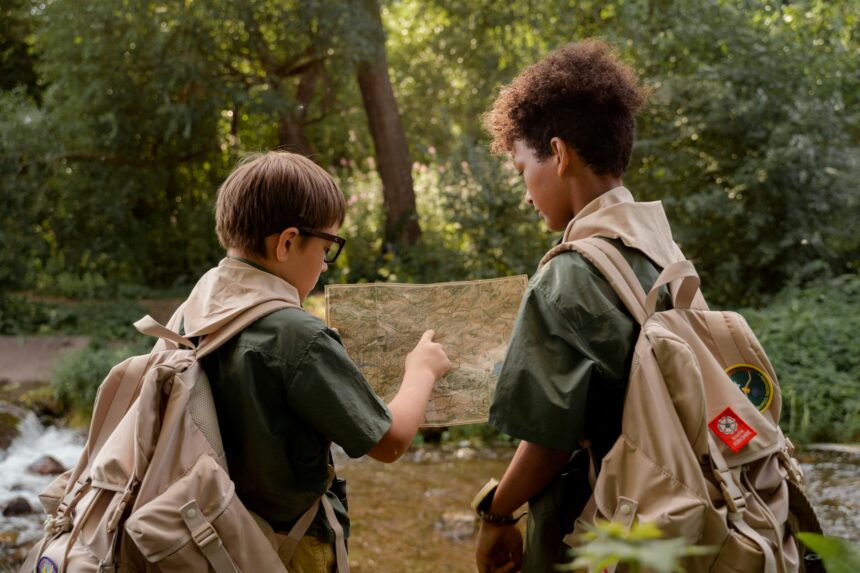 two boys looking a map