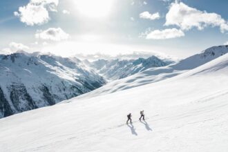 two man hiking on snow mountain