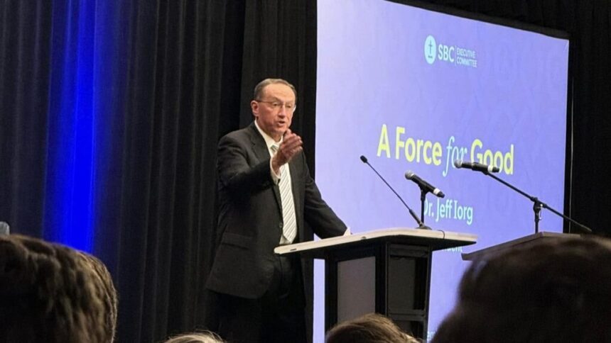 Jeff Iorg, CEO of the Southern Baptist Convention, addressing meeting attendees from behind a lectern.