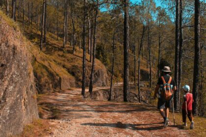 man and kid walking on downhill