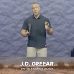 Pastor JD Greear standing on the pulpit of The Summit Church in North Carolina