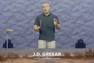 Pastor JD Greear standing on the pulpit of The Summit Church in North Carolina