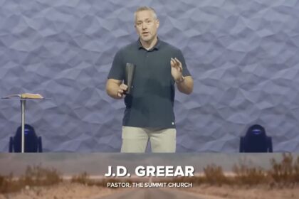 Pastor JD Greear standing on the pulpit of The Summit Church in North Carolina