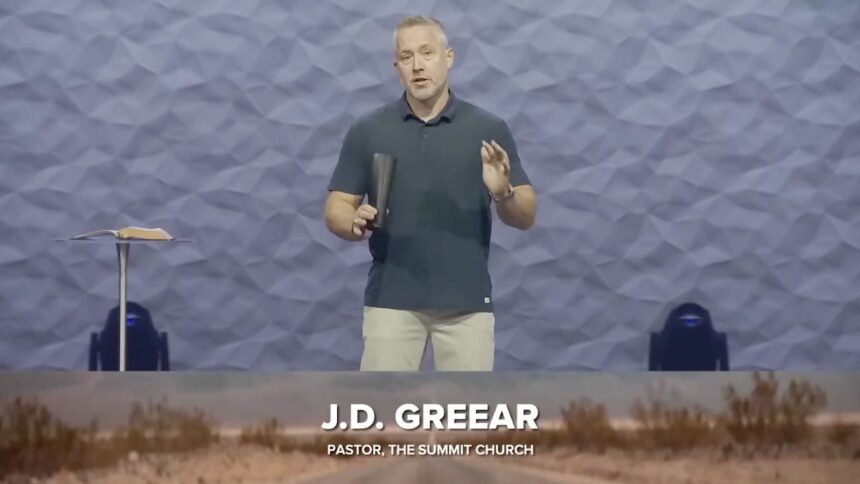 Pastor JD Greear standing on the pulpit of The Summit Church in North Carolina