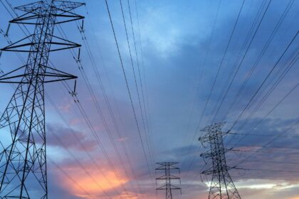 transmission tower under gray sky