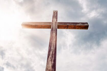 A large cross in the sunlit sky