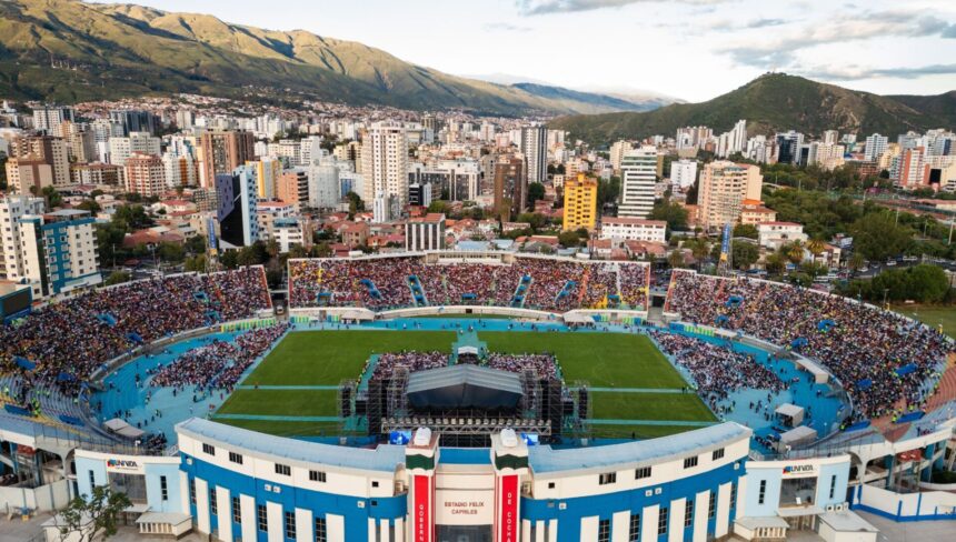 Estadio Félix Capriles in Cochabamba, Bolivia, filled with thousands seeking hope during Esperanza Cochabamba with Will Graham, framed by the stunning Andes mountains in the backdrop.
