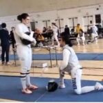 Stephanie Turner took a knee to protest fencing a transgender woman at a USA Fencing event, leading to her disqualification.