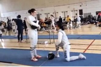 Stephanie Turner took a knee to protest fencing a transgender woman at a USA Fencing event, leading to her disqualification.