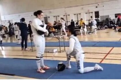 Stephanie Turner took a knee to protest fencing a transgender woman at a USA Fencing event, leading to her disqualification.