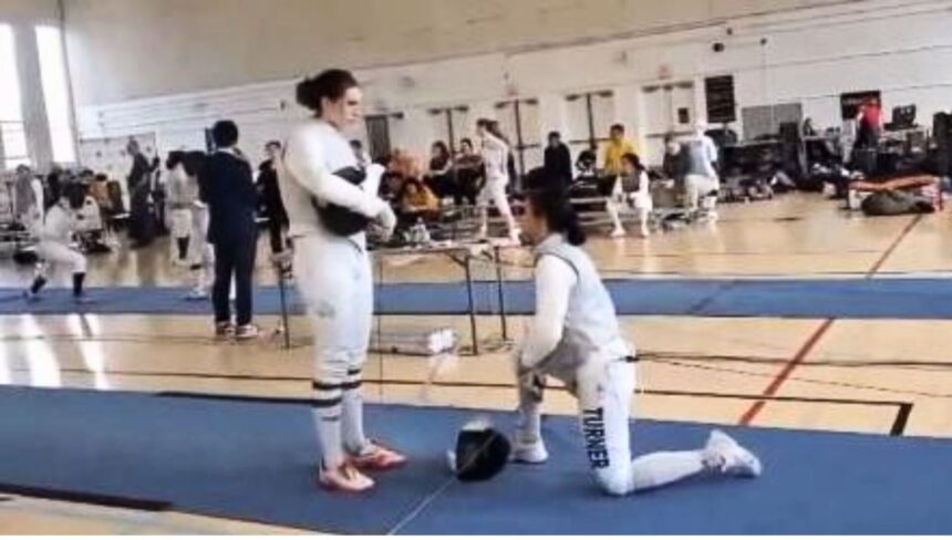 Stephanie Turner took a knee to protest fencing a transgender woman at a USA Fencing event, leading to her disqualification.