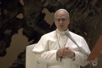 Pope Leo speaks in St. Peter’s Square in Vatican City on Palm Sunday, condemning war as U.S. leaders defend prayer for military service members.