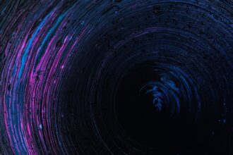 Abstract blue and purple liquid vortex illustrating fluid dynamics and the Navier–Stokes equations.