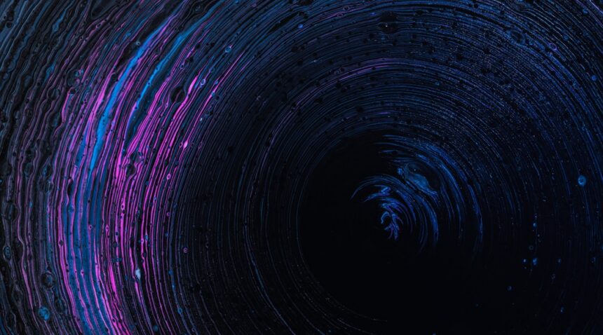 Abstract blue and purple liquid vortex illustrating fluid dynamics and the Navier–Stokes equations.