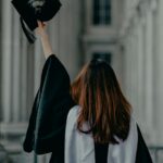 Adult graduate in cap and gown illustrating Long Beach Public Library's diploma program