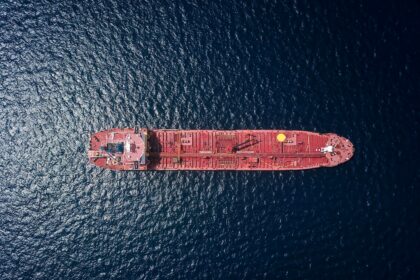 Aerial view of an oil tanker at sea, illustrating shipping risks around the Strait of Hormuz