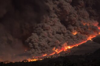 Aerial wildfire and smoke illustrating Indonesia’s forest and peat-fire emergency.