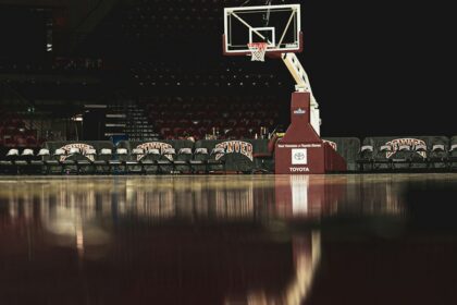 Basketball hoop and arena lights representing Christian witness in professional sports