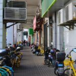 Bicycles and scooters along a walkway