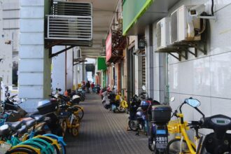 Bicycles and scooters along a walkway