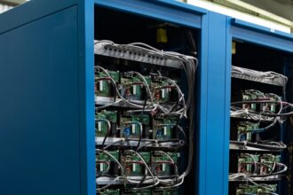 Blue server racks representing the data-center infrastructure behind Google’s planned Finland AI investment.