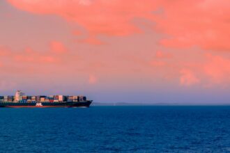 Cargo ship at sea illustrating pressure on Red Sea shipping routes