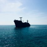 Cargo ship at sea representing shipping through the Strait of Hormuz