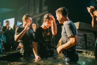 Christian baptism by immersion during a church gathering