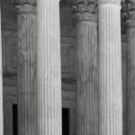Classical courthouse columns representing the American legal system