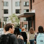 College students walking across campus as Christian groups challenge recognition rules at SUNY Broome