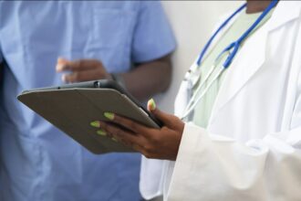 Doctor reviewing healthcare information with a patient