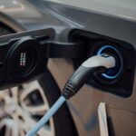 Electric vehicle charging cable plugged into a car