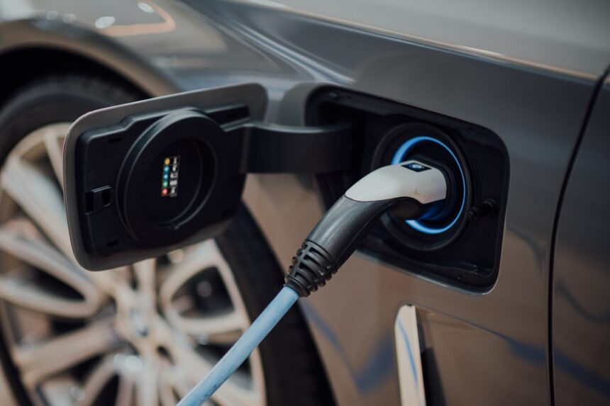 Electric vehicle charging cable plugged into a car