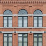 Historic red brick building with arched windows
