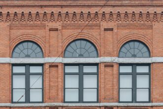 Historic red brick building with arched windows