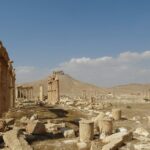Historic stone architecture in Syria under a clear blue sky.