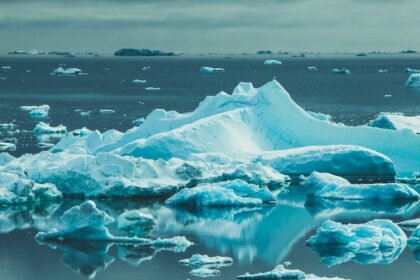 Iceberg floating in an Arctic seascape representing Greenland