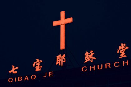 Illuminated cross on a building in Shanghai, used as an illustrative image for religious-freedom reporting