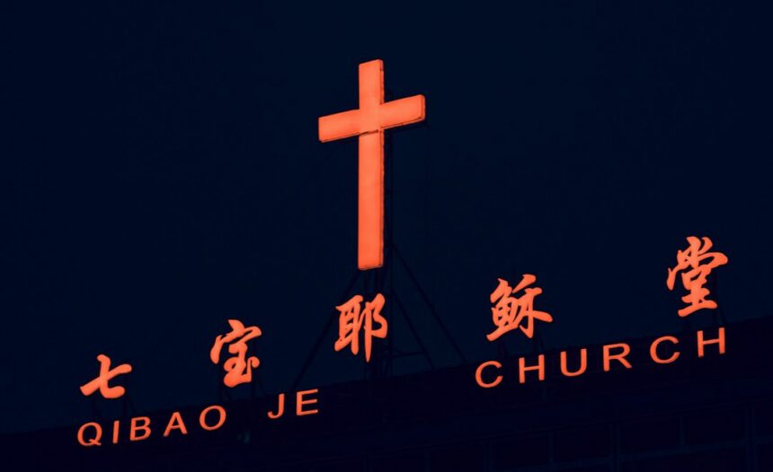 Illuminated cross on a building in Shanghai, used as an illustrative image for religious-freedom reporting